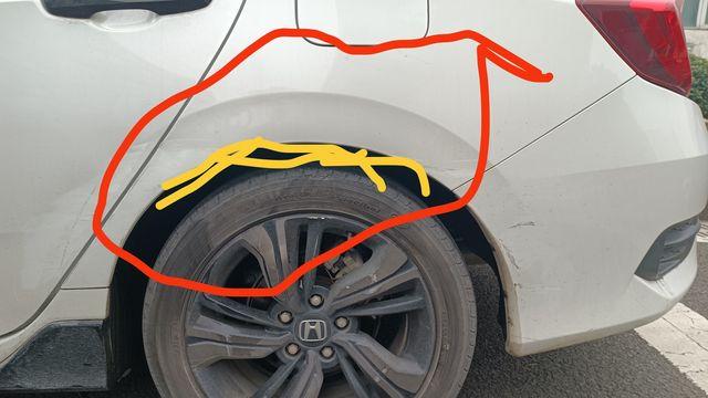 师傅,我问下车子左后轮那块的翼子板做过钣金加喷漆_本田_思域_汽车